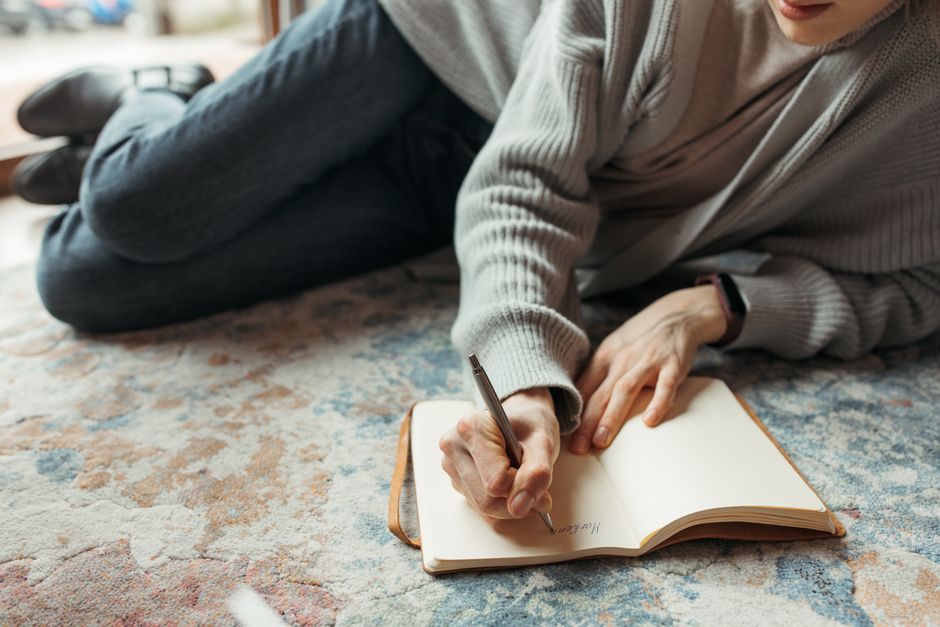person journaling their thoughts during a relationship break