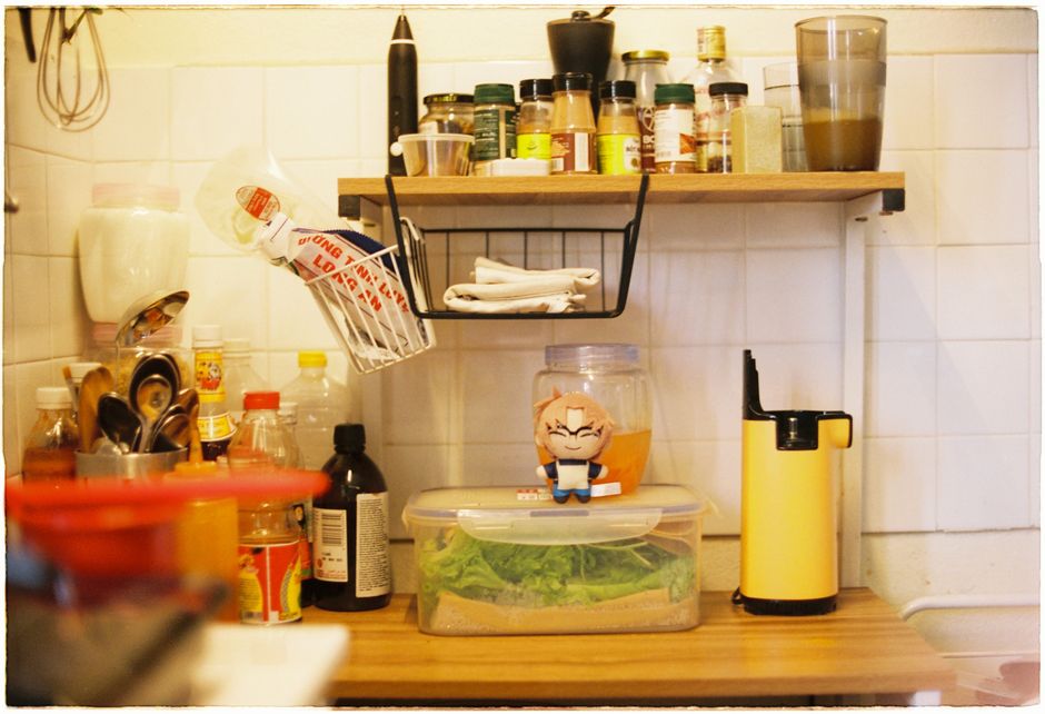 a pull-out spice rack in a kitchen cabinet
