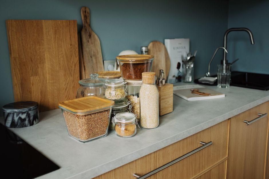 a clear kitchen countertop with a single green plant